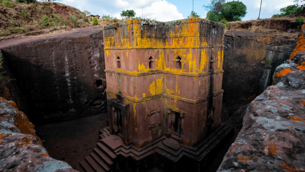 The rock-hewn church of Bete Giyorgis at Lalibela, carved down into red volcanic rock in the shape of a cross