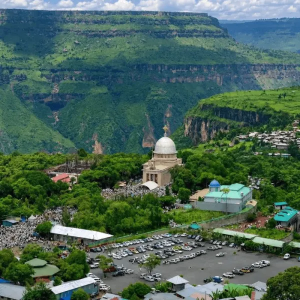 Aerial view of Debre Libanos Monastery and its domed church surrounded by the green cliffs of the gorge in Ethiopia