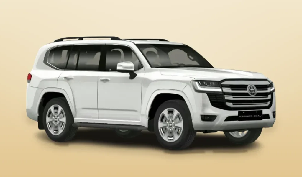 A white Toyota Land Cruiser SUV seen from the front three-quarter angle against a plain cream background