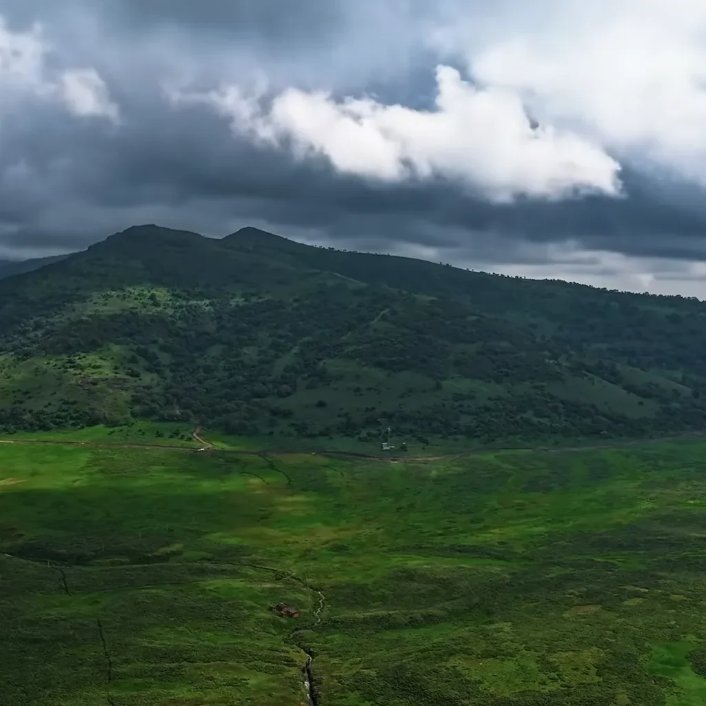 Green mountain and wide plain under dramatic clouds in the Bale Mountains, Ethiopia