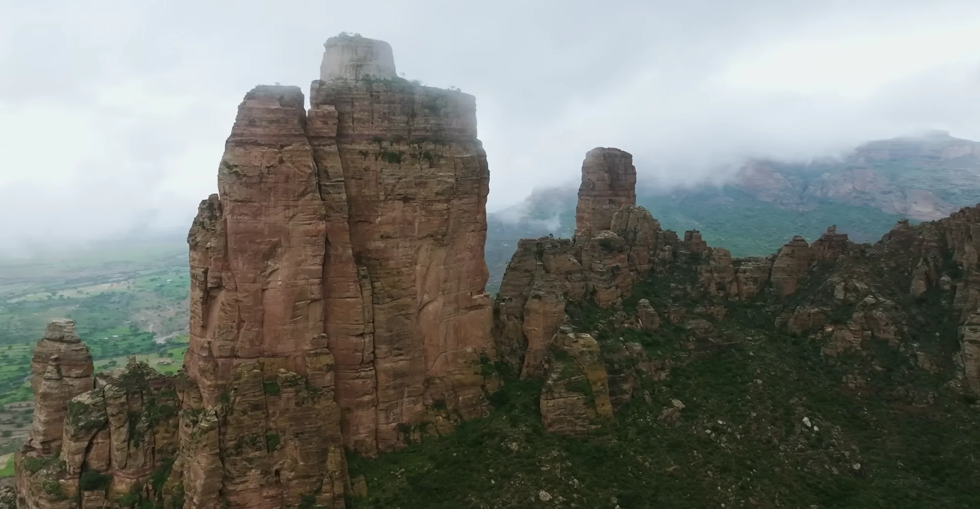 Towering Gheralta sandstone cliff in morning mist, Tigray, Ethiopia